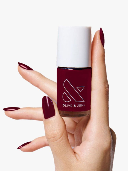 olive and june nail polish in obsessed held by hand